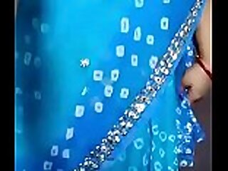 Indian woman stripping saree
